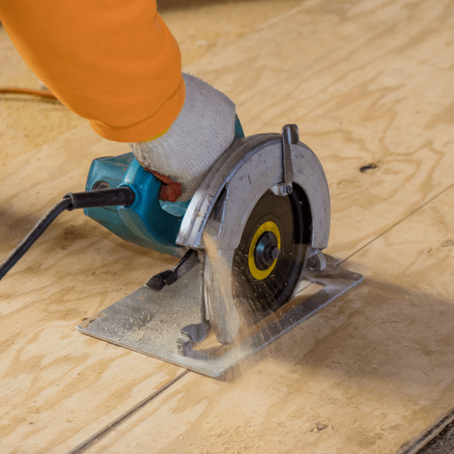 Person cutting plywood